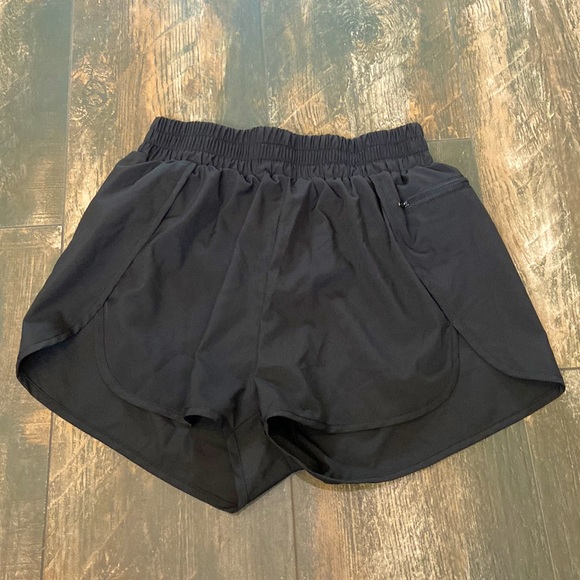Black 2 inch inseam running shorts size medium. - Picture 1 of 3